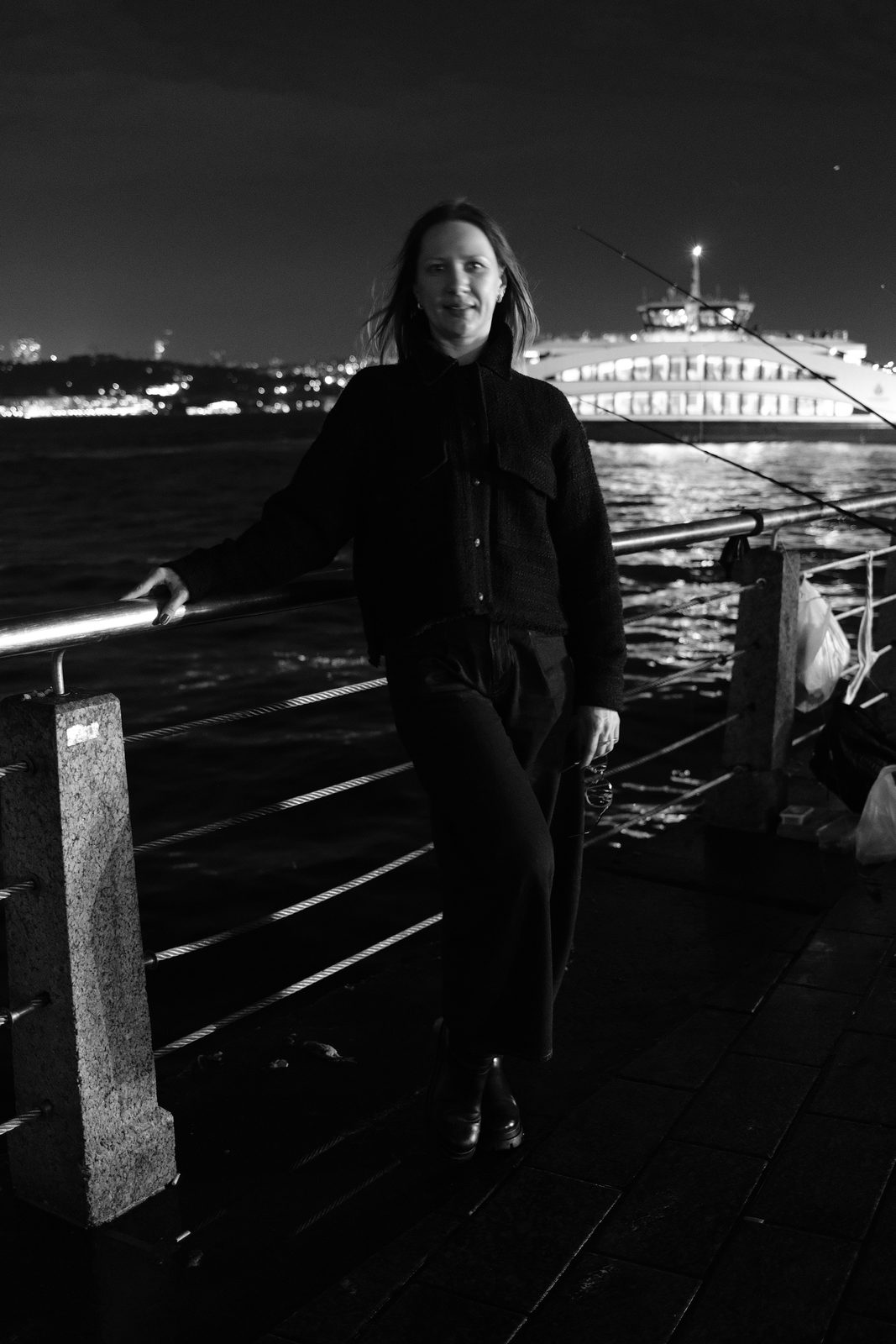 Portrait by the water at night